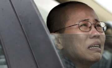 Liu Xia, wife of imprisoned Nobel Peace Prize winner Liu Xiaobo, weeps in anguish after her brother was jailed in June. Photo: AP