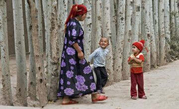 A Uyghur woman with her children in Kashgar, Xinjiang, July 1, 2012. Photo: PHOTONONSTOP