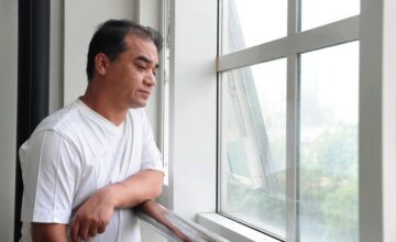 Ilham Tohti pauses before a classroom lecture in Beijing, June 12, 2010.  Photo: AFP